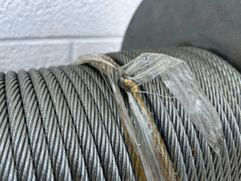 Close-up of end of 1/4" galvanized steel cable. 