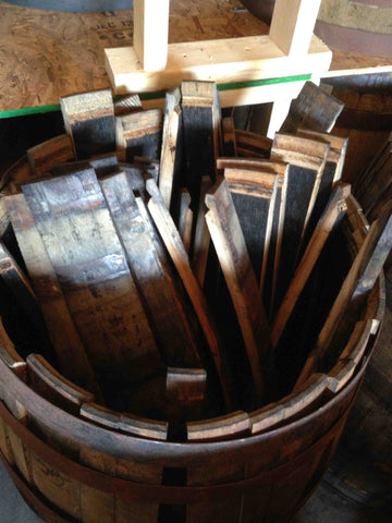 Reclaimed whiskey barrel staves. Material Resourcers repurposes materials from industrial & manufacturing companies. Bring us your waste, excess, non-recyclable, by-product, remnant, blemished, cancelled, and expired materials.
