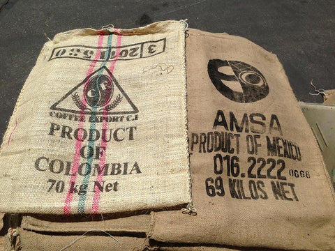 Double-view of burlap coffee bags. Material Resourcers repurposes materials from industrial & manufacturing companies. Bring us your waste, excess, non-recyclable, by-product, remnant, blemished, cancelled, and expired materials.