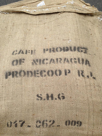 Nicaraguan reclaimed burlap coffee bags. Material Resourcers repurposes materials from industrial & manufacturing companies. Bring us your waste, excess, non-recyclable, by-product, remnant, blemished, cancelled, and expired materials.