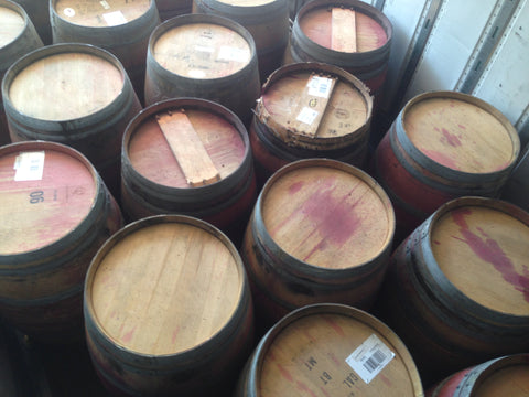 Reclaimed wine barrels loaded on truck. Material Resourcers repurposes materials from industrial & manufacturing companies. Bring us your waste, excess, non-recyclable, by-product, remnant, blemished, cancelled, and expired materials.