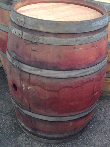 Single reclaimed wine barrel. Material Resourcers repurposes materials from industrial & manufacturing companies. Bring us your waste, excess, non-recyclable, by-product, remnant, blemished, cancelled, and expired materials.