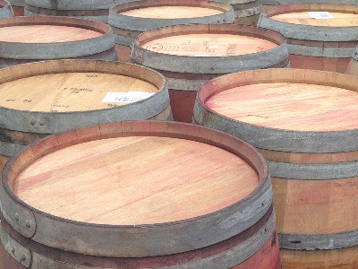 Another view of reclaimed wine barrels. Material Resourcers repurposes materials from industrial & manufacturing companies. Bring us your waste, excess, non-recyclable, by-product, remnant, blemished, cancelled, and expired materials.